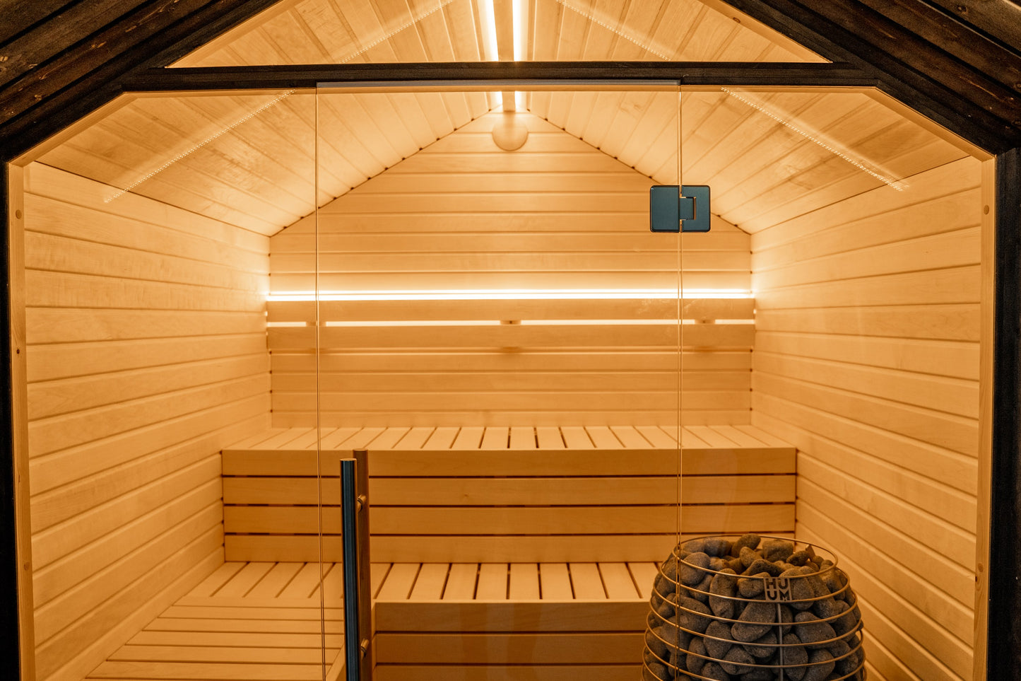Steam & Oak Tartu pre-assembled sauna house, blackened spruce with full glass gable and aspen interior, view 2